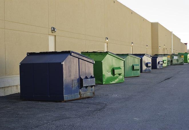 a site supervisor checking a construction dumpster in Cade LA